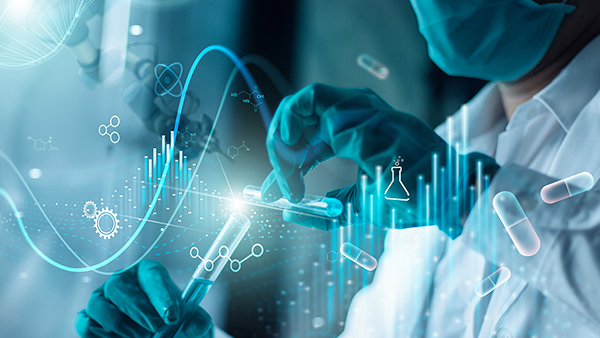 Silhouettes of people helping each other on a mountain at sunrise